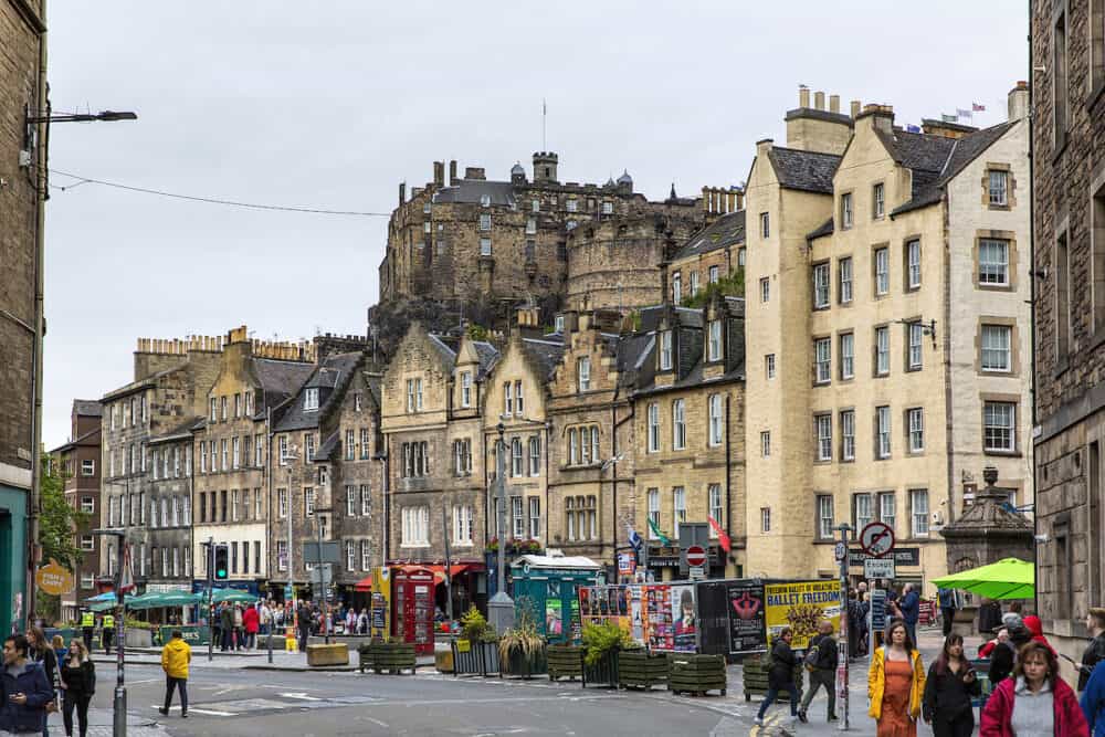 EDINBURGH, SCOTLAND - Edinburgh street views, old town. People walking on the road. Edinburgh International Festival