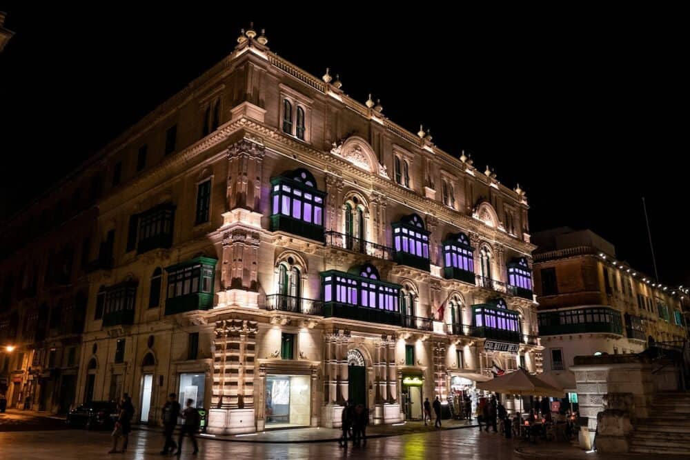 Palazzo Ferreria building at night illuminated by lights