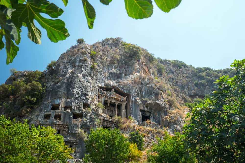 Fethiye rock tombs - 4th BC tombs carved in steep cliff. City of Fethiye, Turkey.