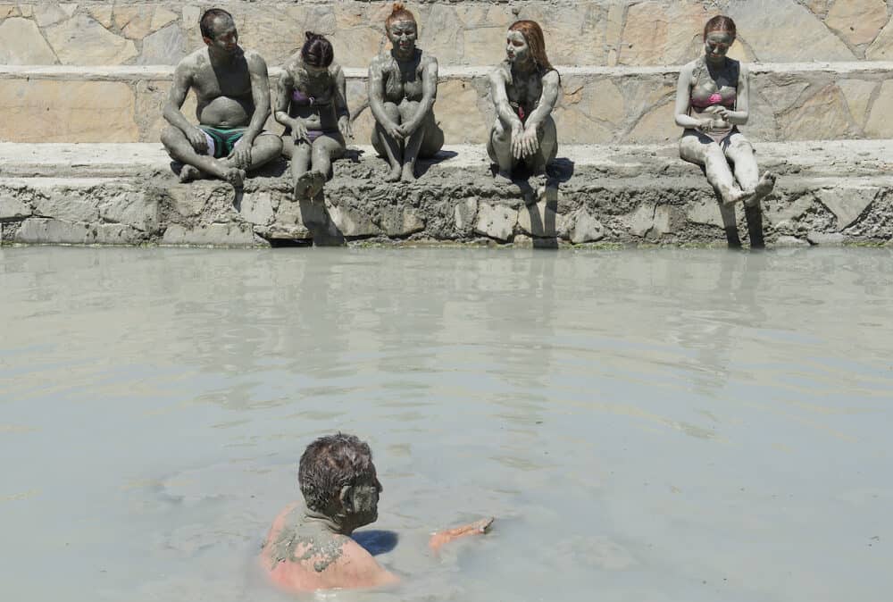 SULTANIYE, TURKEY - People are taking a mud bath.
