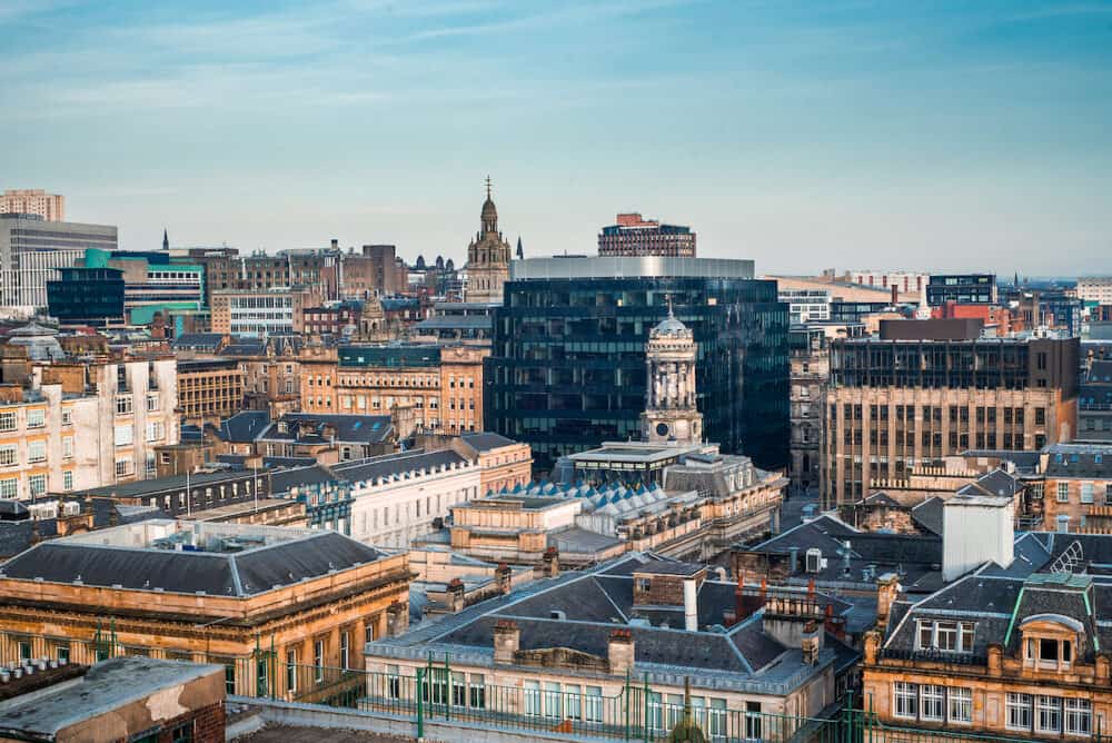 A rooftop view of the mixed architecture of old and new buildings in Glasgow city in late afternoon light, Scotland