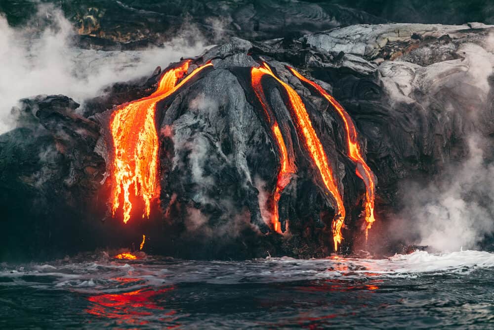 Active lava flow volcanic eruption magma touching the ocean in Big Island, Kilauea volcano, Hawaii.