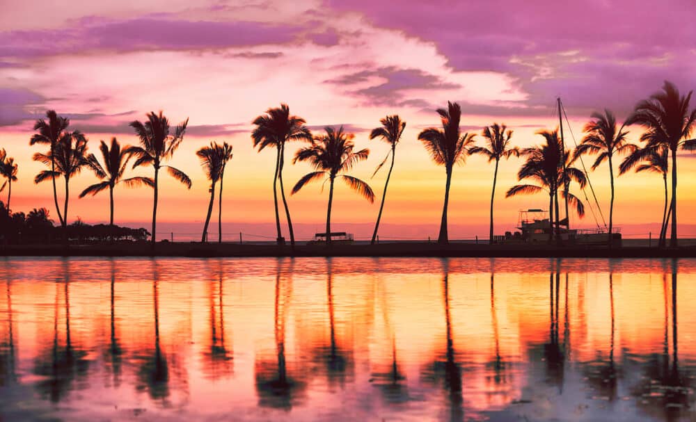 Hawaii beach sunset scenic panoramic banner background for summer vacation, romantic honeymoon travel destinations.