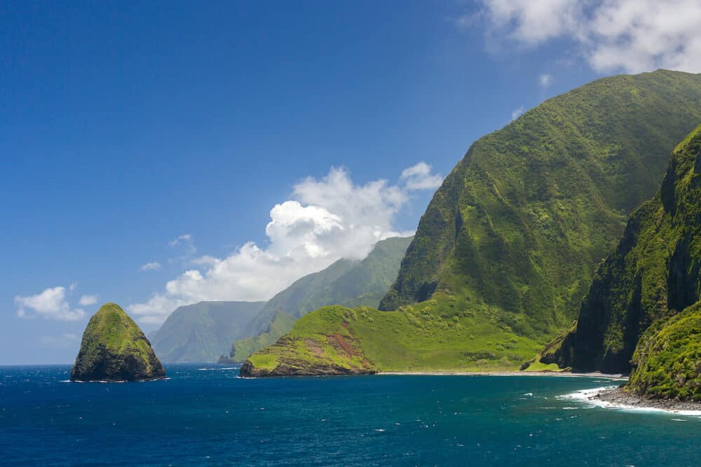The world tallest sea cliffs of Molokai in a blue sky bright day light, Hawaii.
