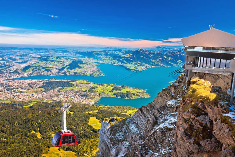 Mount Pilatus aerial cabelway above and town of Luzern aerial view, central Switzerland landscape
