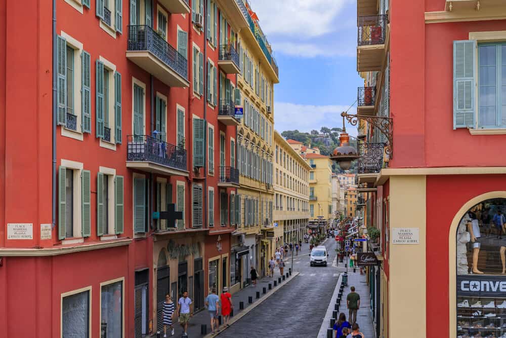 Nice, France -  Colorful houses in the street of the Old Town, Vieille Ville off of Place Massena in Nice, French Riviera