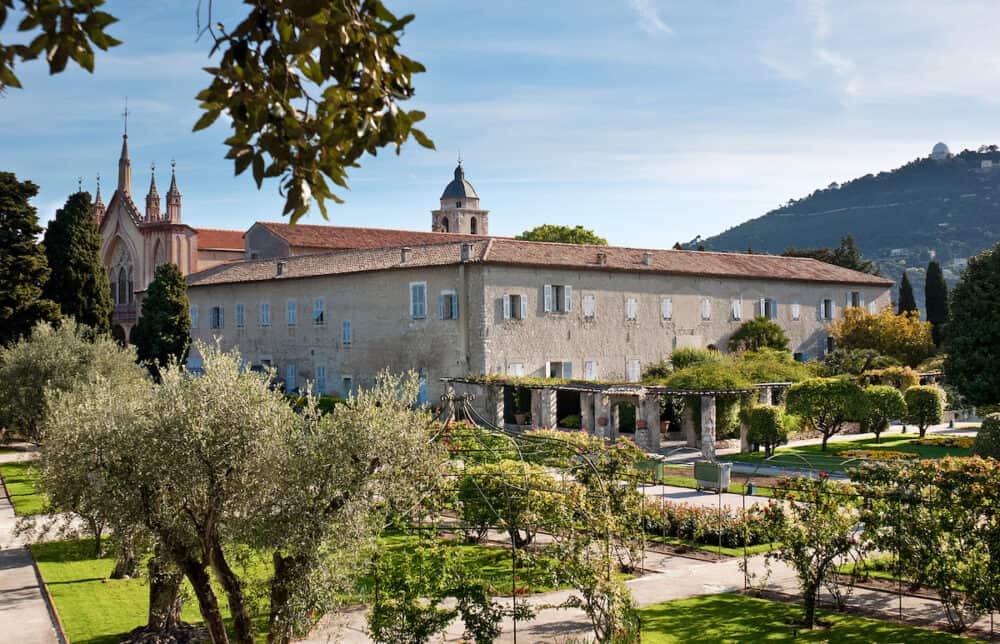 NICE, FRANCE -  Monastery of Our Lady of Cimiez is surrounded by great garden with old olive trees and variety of rose bushes 