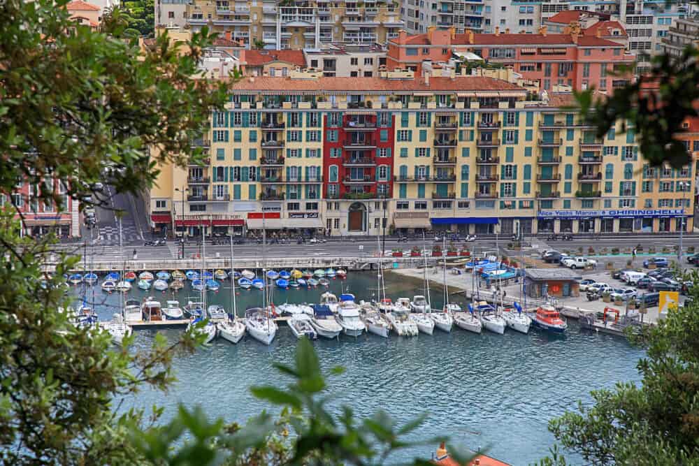 NICE, FRANCE - Yachts and architecture in the Port de Nice in French Riviera, France. The Nice Marina as seen from the top of Le Chateau.