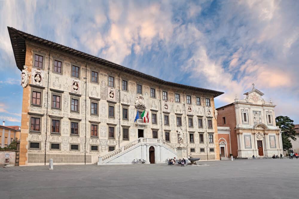 PISA, ITALY - ancient Palazzo della Carovana, built in 1562-1564 by Giorgio Vasari, and church Santo Stefano dei Cavalieri in Piazza dei Cavalieri (Knight's Square).