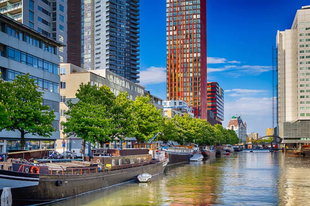 Netherlands Traveling. Attractive Cityscape of Rotterdam City with Canal and Boats in The Netherlands. Horizontal Image Composition