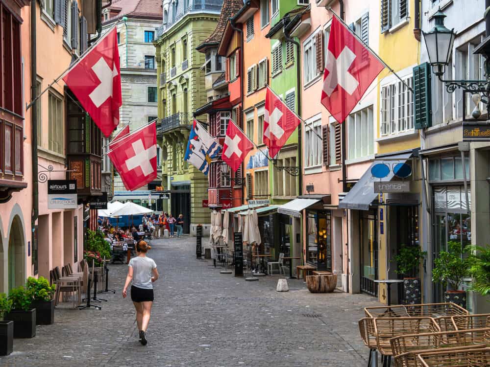 Zurich, Switzerland - A view of the street of the old town of Zurich, decorated with national flags