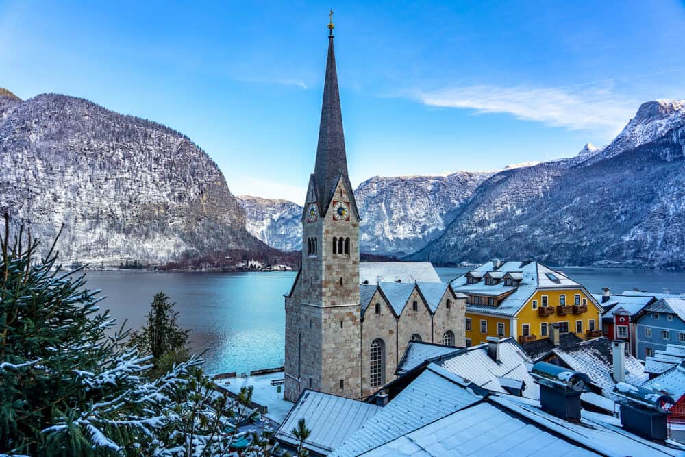 beautiful cityscape of the special city Hallstatt in Austria Salzkammergut snowy winter mountains and lake and church