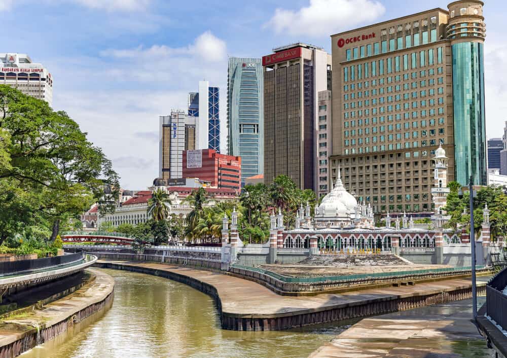 Malaysia, Kuala Lumpur, Skyscrapers in modern metropolis in Kuala Lumpur the capital city of Malaysia. Concept of green environment in the city.