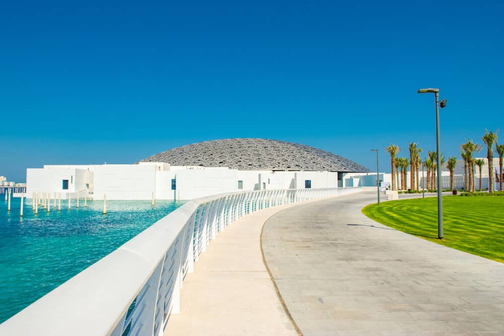 Abu Dhabi, UAE - A spectacular and unique  exterior of the Louvre Abu Dhabi museum with dome and sea lagoon, opened on the Saadiyat island