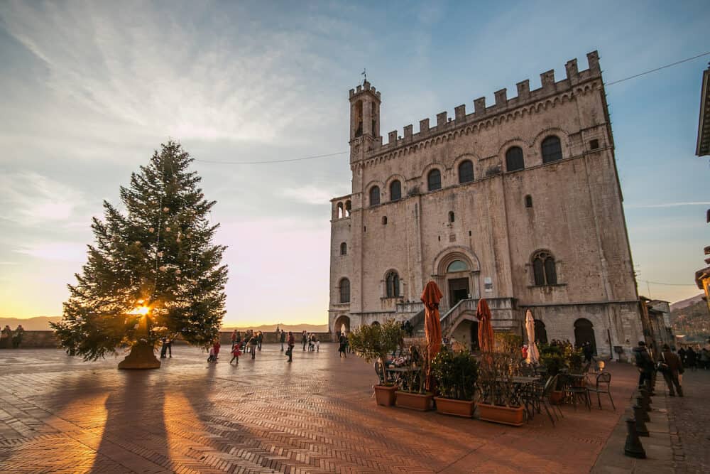 GUBBIO, ITALY - Beautiful square of Gubbio at sunset with christmas tree