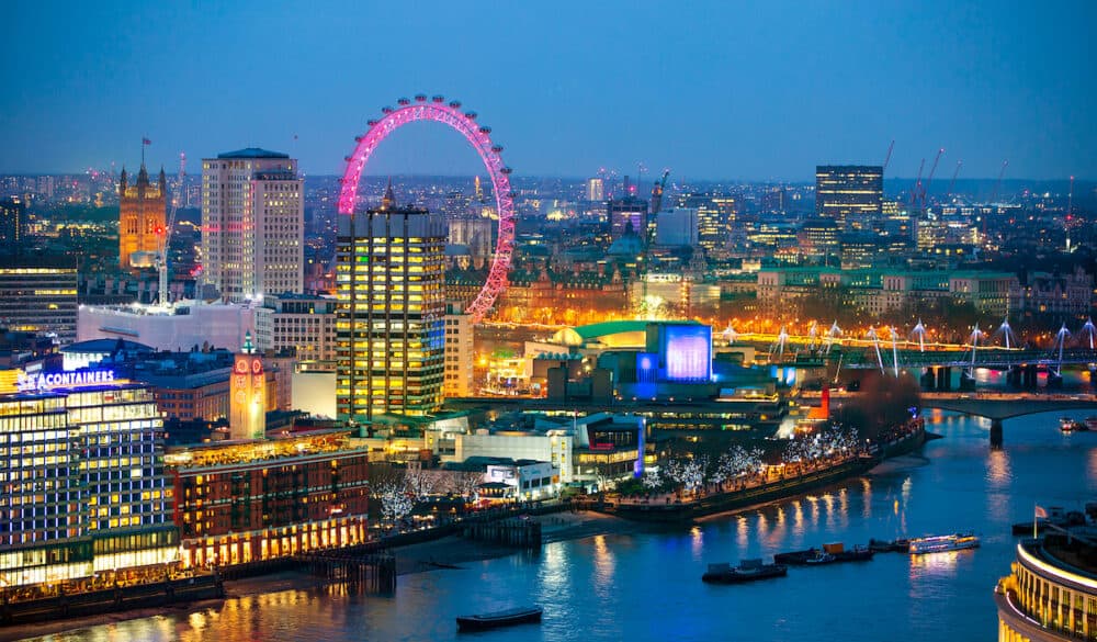 London, UK - London at sunset with lights and reflection. View at the Westminster aria, London eye, River Thames, embankment and London bridge