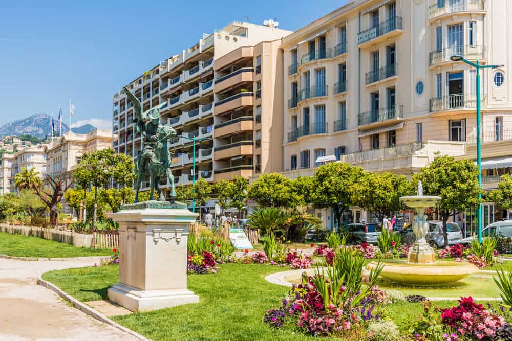 Menton France. A view of Jardins Bioves and the Statue of the Attachment in Menton in France
