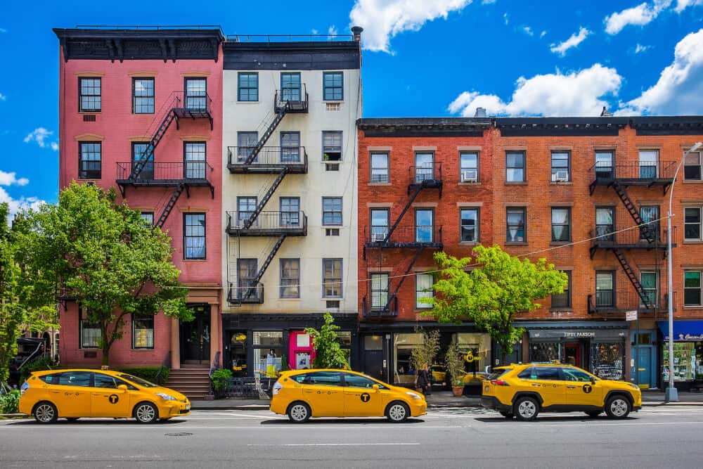 New York City, USA - view of three yellow cabs parked in a street of Chelsea district