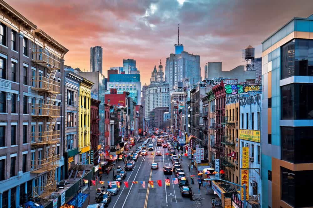 New York, USA -  New York City Chinatown and downtown skyscrapers scenic sunset view, United States of America. Vibrant street of NYC.