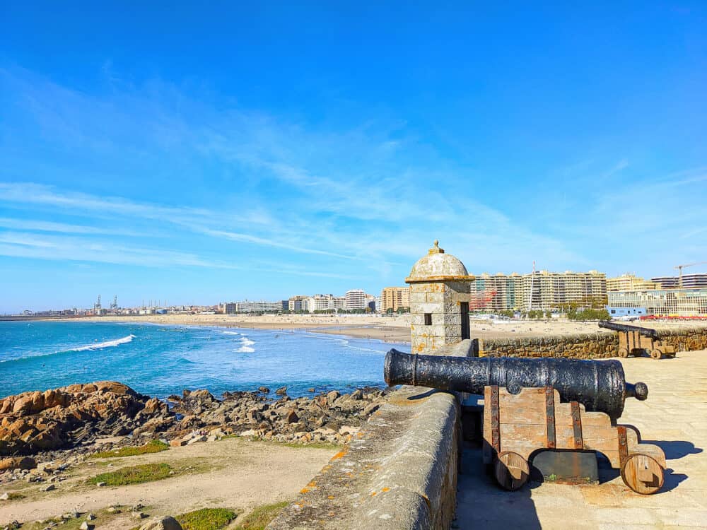 Queijo fort on the Matosinhos beach, cityscape and port Leixoes in background, Porto, Portugal