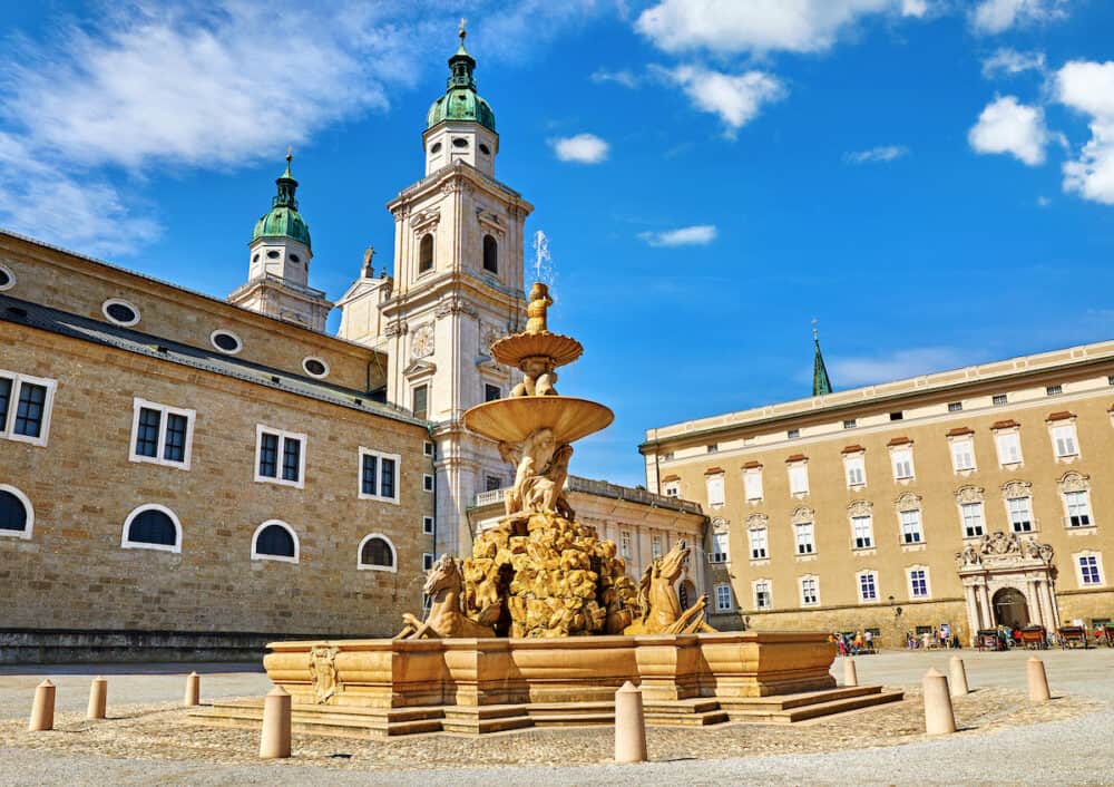 Salzburg, Austria. Fountain at central Residenzplatz with cathedral and town hall in old town. Famous austrial landmark.