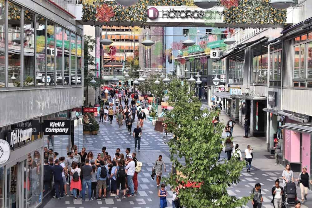 STOCKHOLM, SWEDEN - People visit Drottninggatan shopping street in Norrmalm district, Stockholm, Sweden. Stockholm is the capital city and most populous area in Sweden.