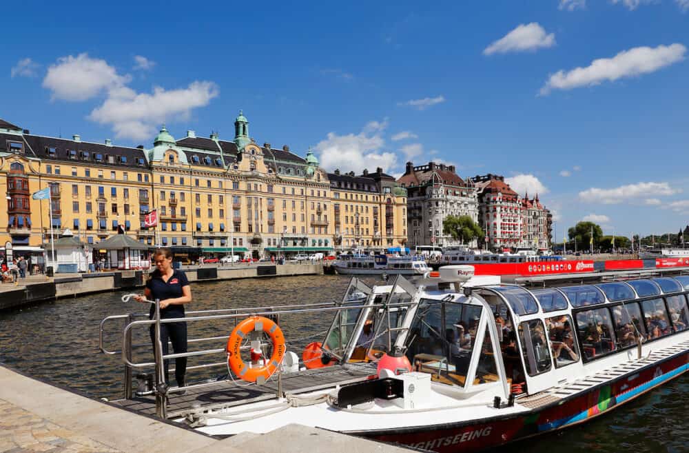 Stockholm, Sweden - Sightseeing boat operated by Red sightsseeing hop-on hop-off service at Nybrokajen.