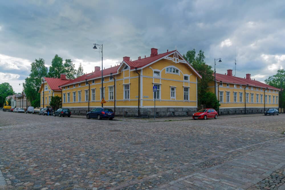 View of old wooden houses in Port Arthur district with locals and visitors in Turku Finland
