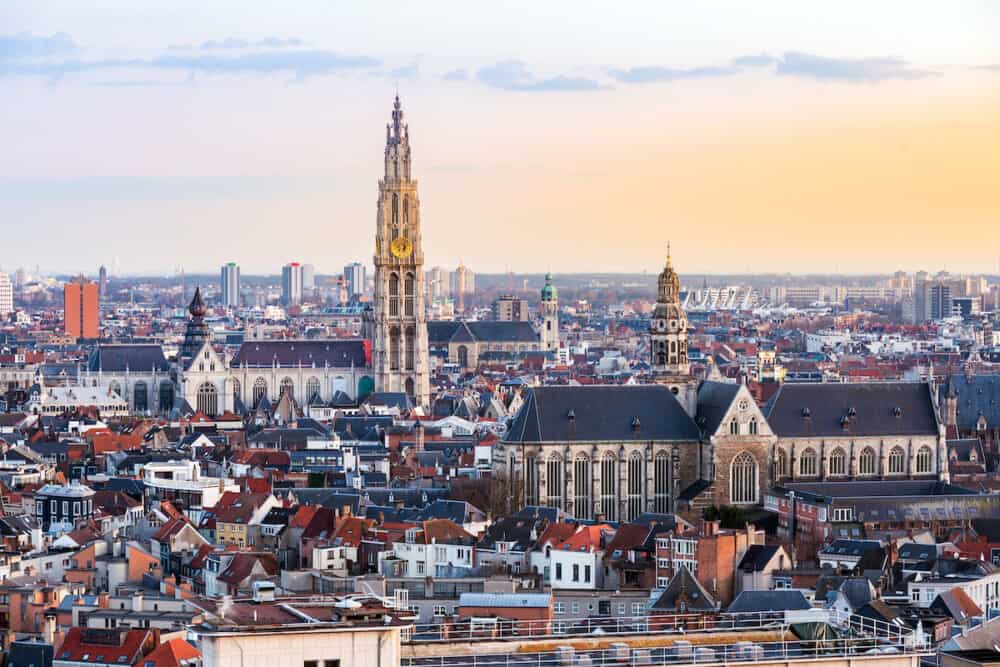Aerial high angle view landscape of Antwerp cityscape with cathedral of Our Lady, Antwerpen Belgium sunset. EU Begium city landmark for tourism and travel destination.