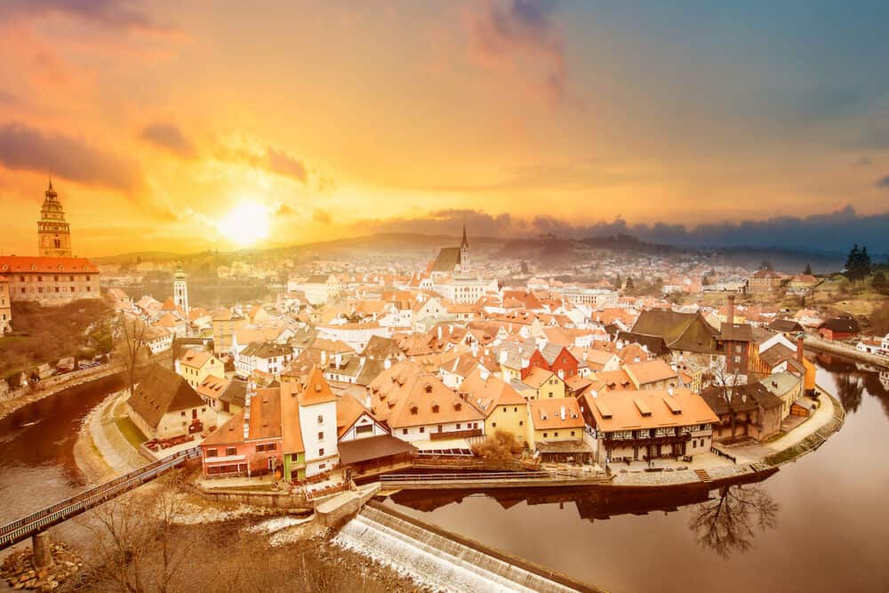Aerial view panorama of the old Town of Cesky Krumlov in South Bohemia, Czech Republic during sunset. World heritage Site and famous place for tourism in Bohemia, Czech Republic