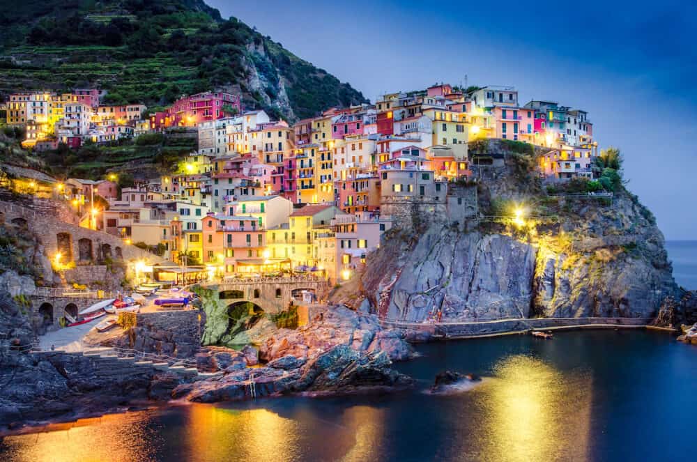 Scenic night view of colorful village Manarola in Cinque Terre Italy