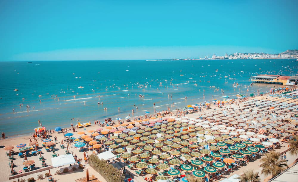 Sunny day and panoramic view to Durres beach. Blue sky and water of Adriatic Sea.