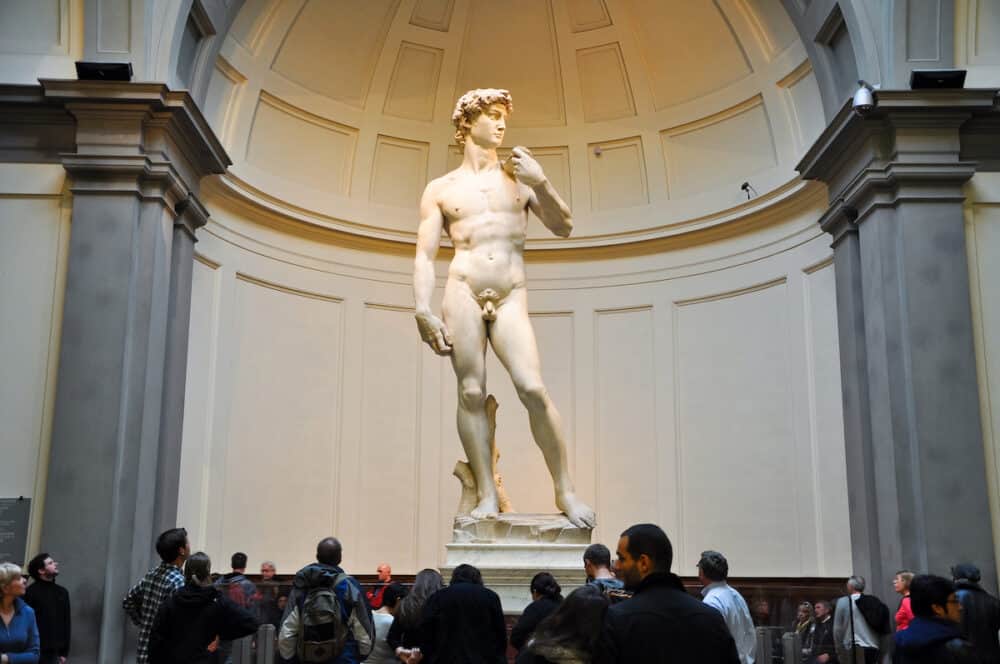 FLORENCE- Tourists look at David by Michelangelo in Galleria dell'Accademia in Florence. Italy.