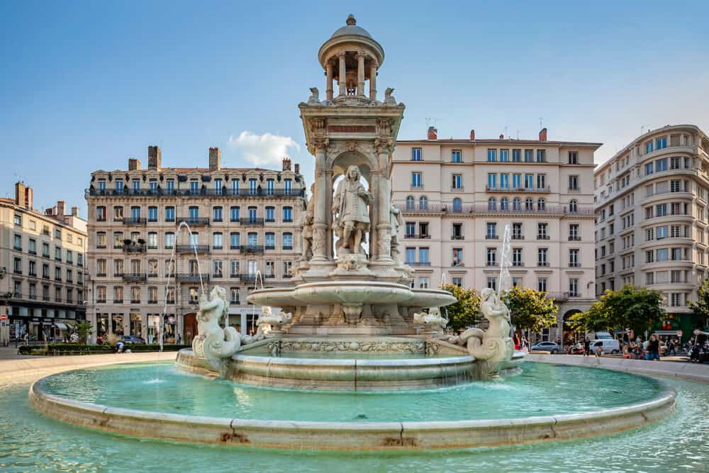  Lyon, France: Fountain at Jacobin square with relaxing people and tourists