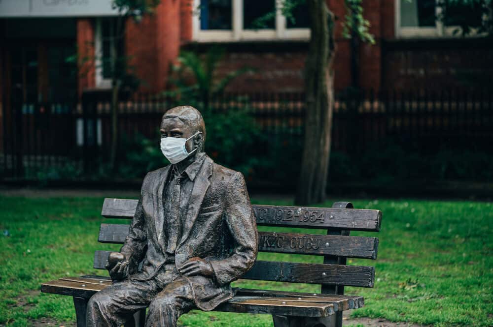MANCHESTER, ENGLAND, UK -  City centre of Manchester, Alan Turing statue in face mask, the memorial is in Sackville Park. New normal concept
