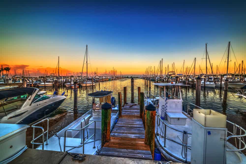 Boats in Coconut Grove harbor at sunset. Florida, USA