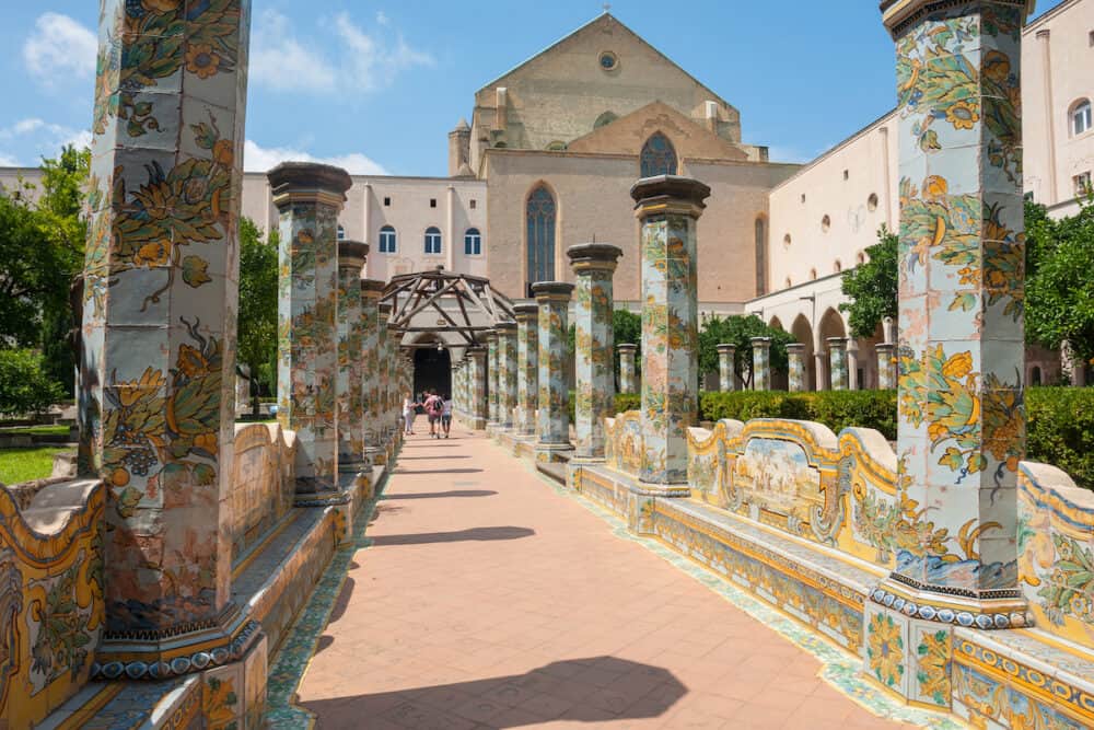 NAPLES, ITALY - Sunny cloister of the Clarisses decorated with majolica tiles from Santa Chiara Monastery in Naples, Italy.