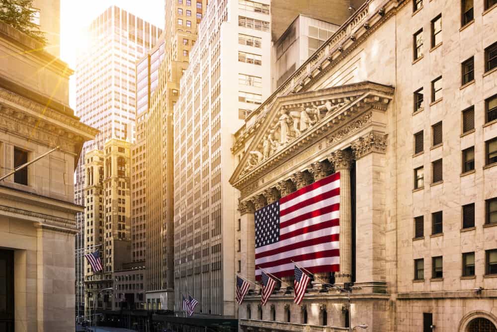 Famous Wall street and the building in New York New York Stock Exchange with patriot flag