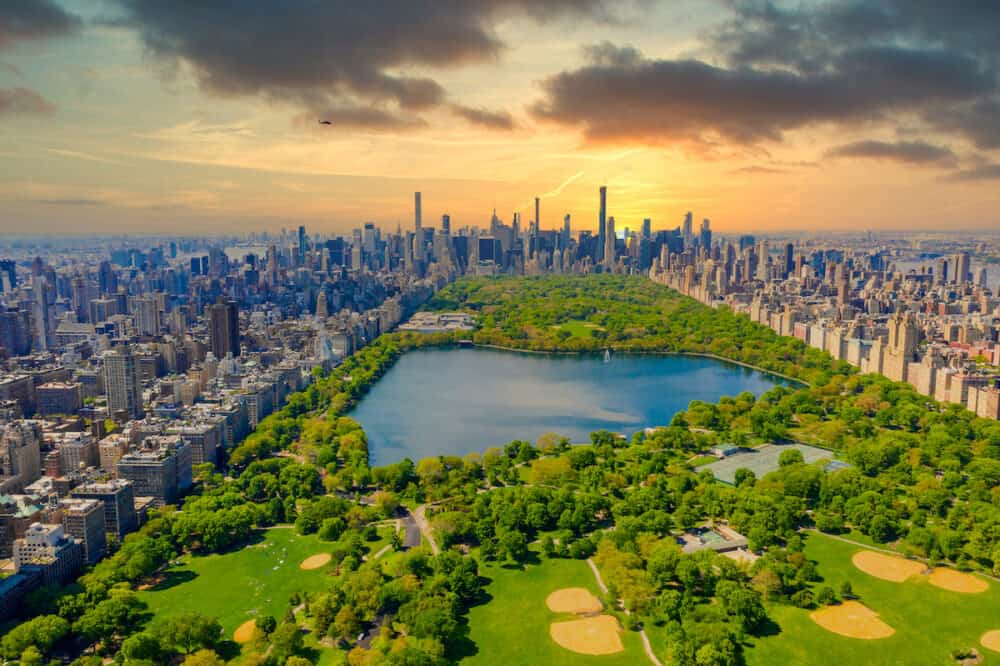 Aerial view of Manhattan New York looking south up Central Park during epic sunset over the city.