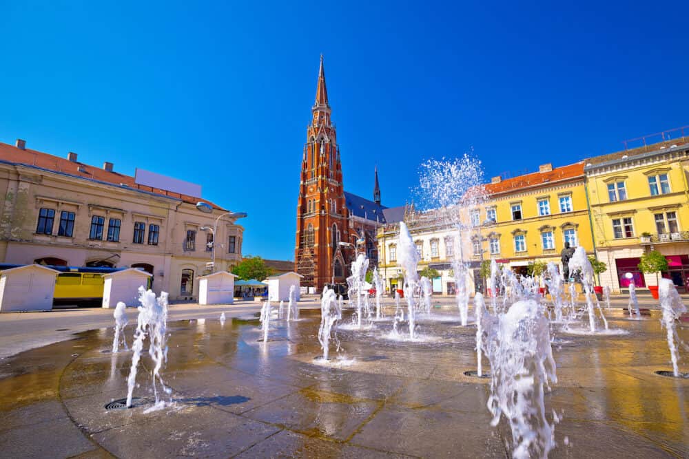 Osijek main square fountain and cathedral view, Slavonija region of Croatia