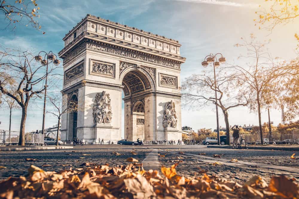 Arc de Triomphe located in Paris in autumn scenery.