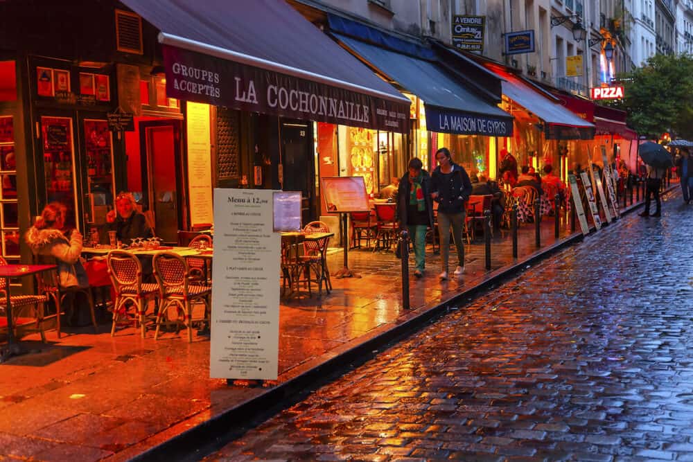 PARIS, FRANCE - Wine Bars Restaurants Colorful Rainy Streets Tourists Lovers Walking Latin Quarter West Bank Seine Latin Quarter Rue De La Harpe Paris France