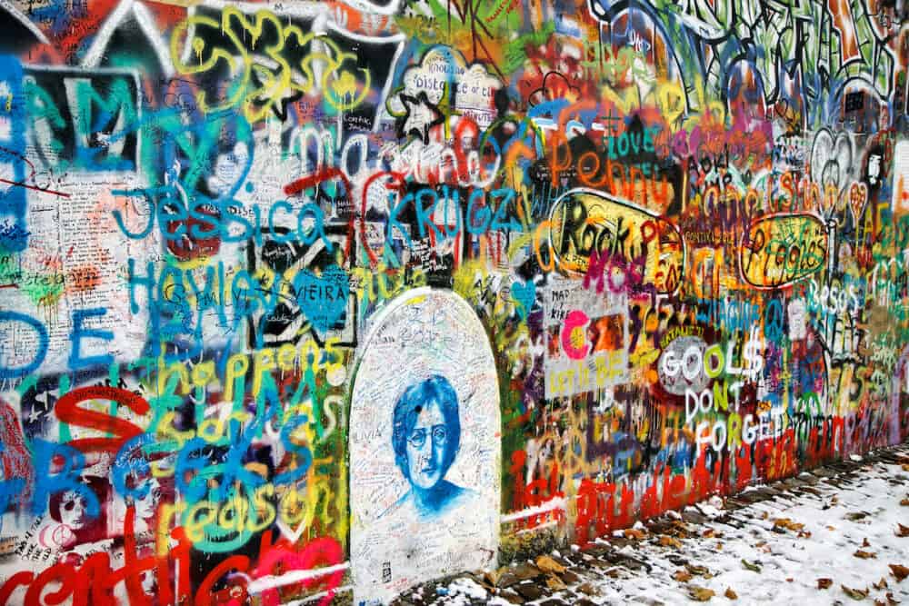 PRAGUE, CZECH REPUBLIC - The Lennon Wall since the 1980s filled with John Lennon-inspired graffiti and pieces of lyrics from Beatles songs in Prague, Czech Republic