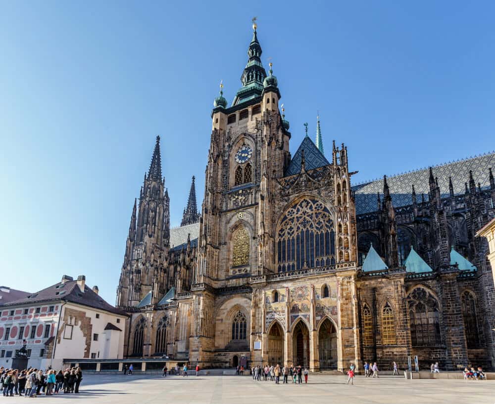 PRAGUE - Tourist at Saint Vitus Cathedral in Prague. This cathedral is an excellent example of Gothic architecture the biggest and most important church in the country