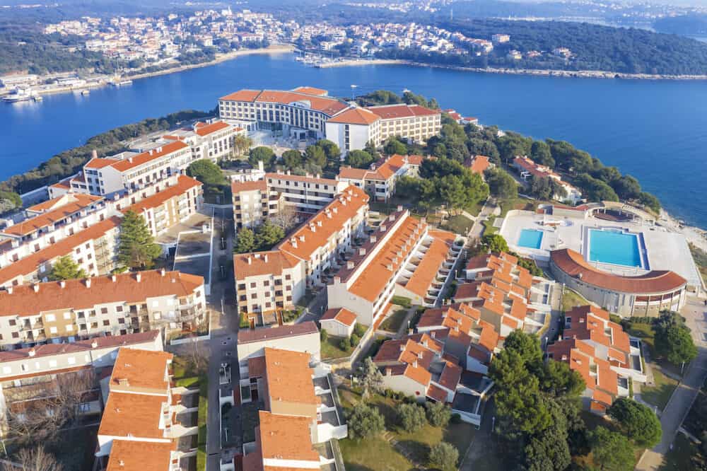PULA, CROATIA -  Modern Hotel Park Plaza and hotel facilities, in background Pjescana Uvala, aerial view, Pula, Istria, Croatia