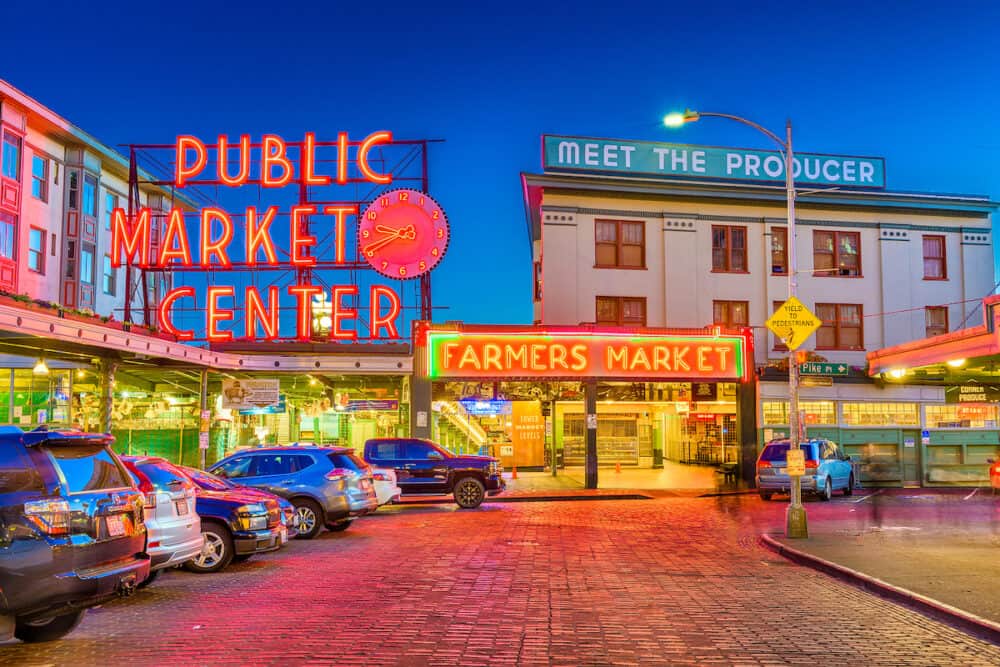 SEATTLE; WASHINGTON - Pike Place Market at night. The popular tourist destination opened in 1907 and; is one of the oldest continuously operated public markets in the United states.