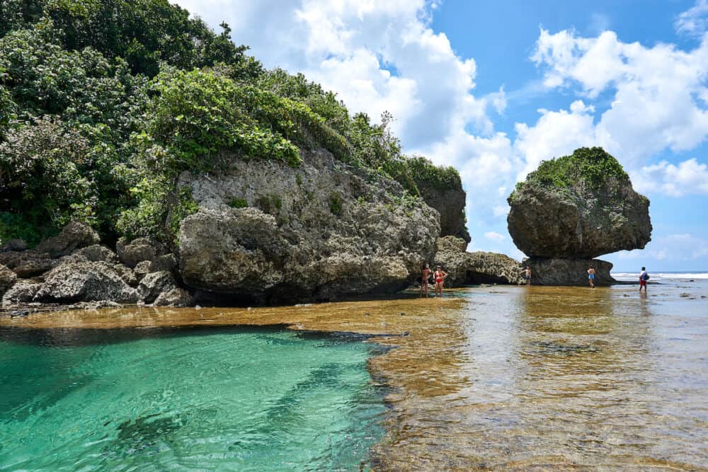 Philippines, Siargao Tourists visit magpupungko natural rock pools in Siargao, Philippines.