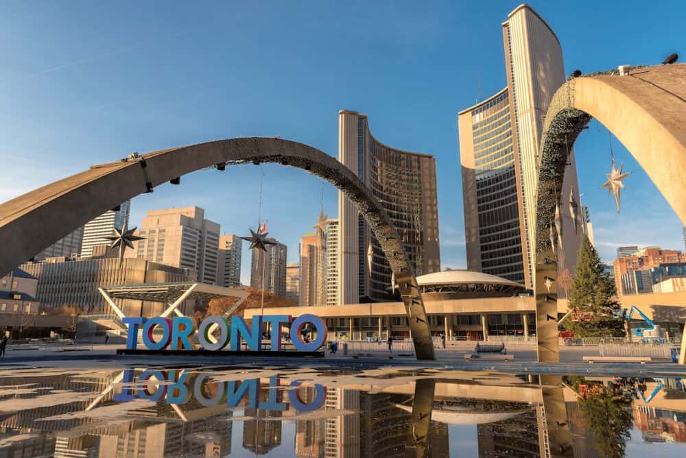 Toronto city hall and Toronto Sign in downtown at sunset, in Toronto, Ontario, Canada