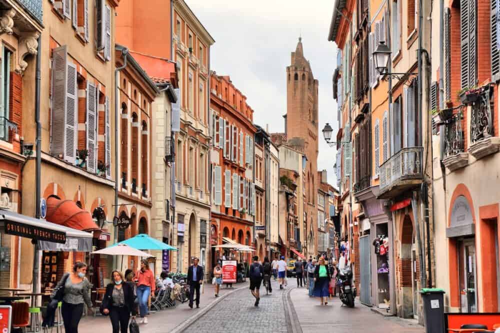 TOULOUSE, FRANCE - People visit downtown Toulouse city, Capitole district. Toulouse is the 4th largest commune in France.