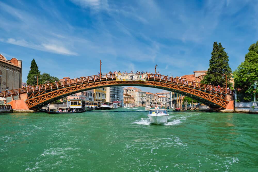 VENICE, ITALY - Ponte dell'Accademia bridge with boat passing under on Grand Canal, Venice, Italy